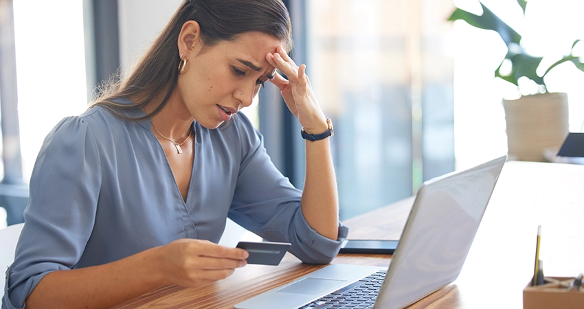 concerned woman holding card
